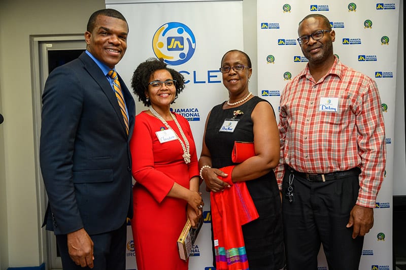 (L-R) Dr Ransford Davidson, Business Relationship and Sales Manager, JN Bank Brown’s Town shares lens time with Ms Claudine Allen, JN Group Member Ombudsman; and, JN Circle Brown’s Town members:  Mrs Heather Johnson , Principal of the St Hilda's Diocesan High; and, Mr Delroy Palmer, Bursar of the Brown's Town Community College. They were at the inaugural meeting of the JN Circle, Brown’s Town Chapter in December 2019.